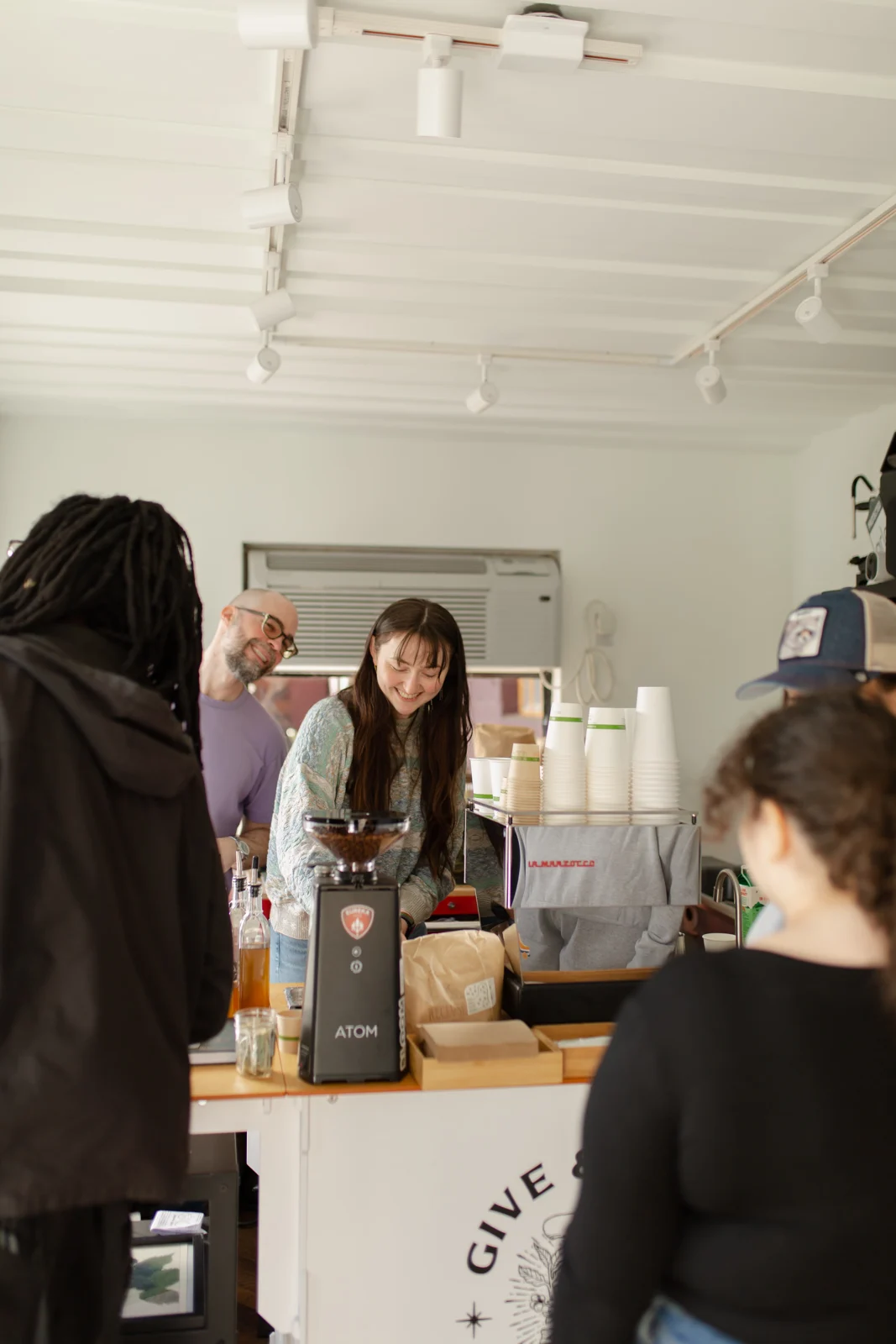 Aja serving guests on opening day, February 5, 2024